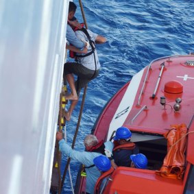 Three men were rescued off New Caledonia by a P&O cruise ship.