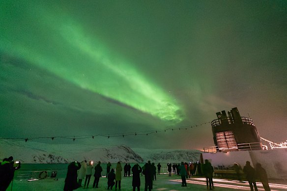 Passengers brave below freezing temperatures to witness the planet’s greatest light show.