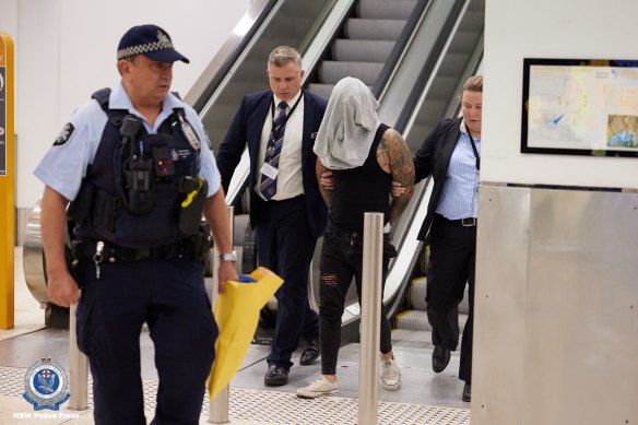 Le Nghia “Andy” Pham, 26, is arrested at Sydney Airport on Sunday over the shooting of Taha Sabbagh in Sydney’s south-west on March 2.