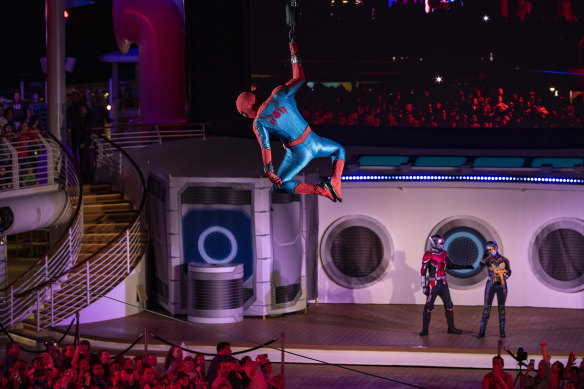 Spider-Man swings in during the Heroes Unite show.