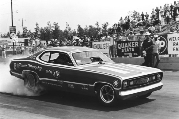 Murphy in action with her “Miss STP” Plymouth Duster during an early 1970s drag race. 