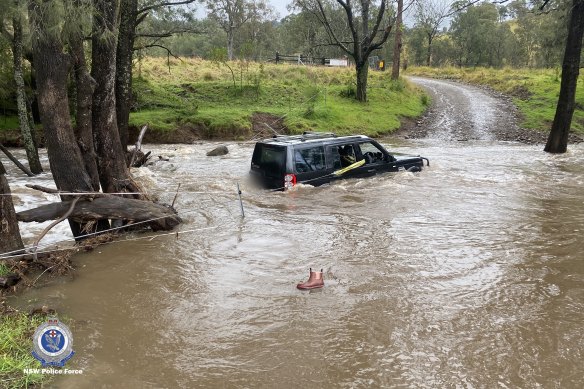 A police officer rescued a four-year-old boy and two women from this car near Dungog.