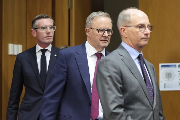 From left: NSW Premier Dominic Perrottet, Prime Minister Anthony Albanese and Chief Medical Officer Paul Kelly exiting today’s national cabinet meeting. 