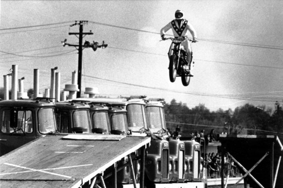 Evel Knievel jumps over 10 Mack trucks, but could he clear the gulf between economic rhetoric and reality?