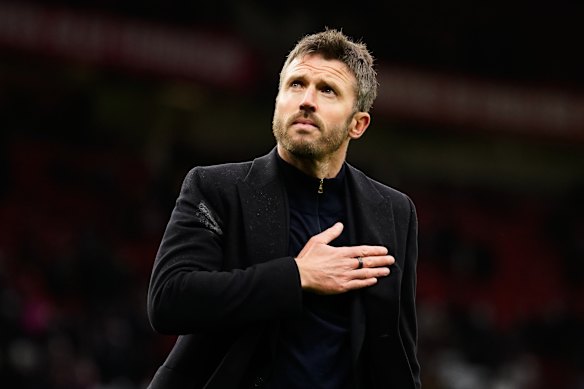 Michael Carrick reacts to supporters after his team lost.
