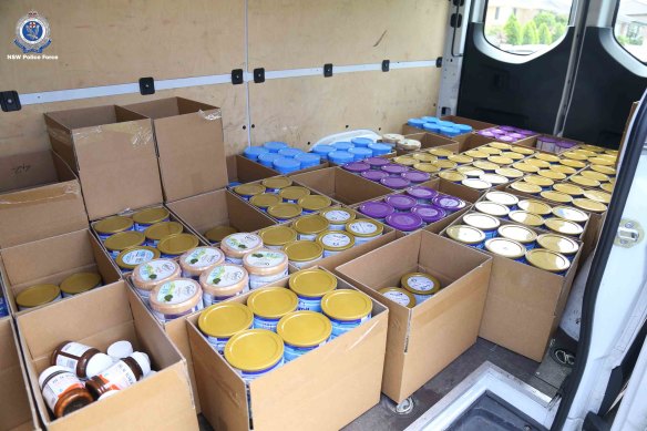 More than 1350 tins of allegedly stolen baby formula were found across two locations in western Sydney.