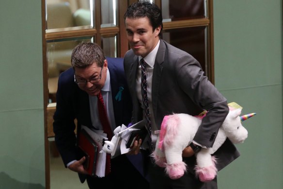 Pat Conroy (left) and Tim Watts bow to the Speaker after being ejected for displaying unicorn props in question time in 2016.