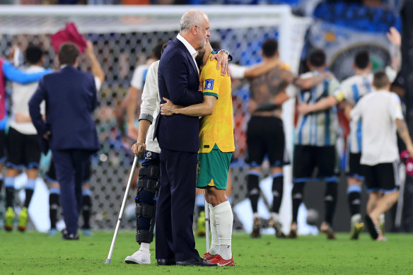 Arnold consoles Aziz Behich at the end of their World Cup road.