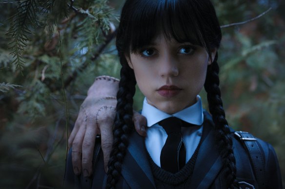 Thing and Jenna Ortega as Wednesday in Tim Burton’s Addams Family reboot.
