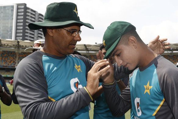 Pakistan great Waqar Younis presents 16-year-old Naseem Shah with his first Test cap.