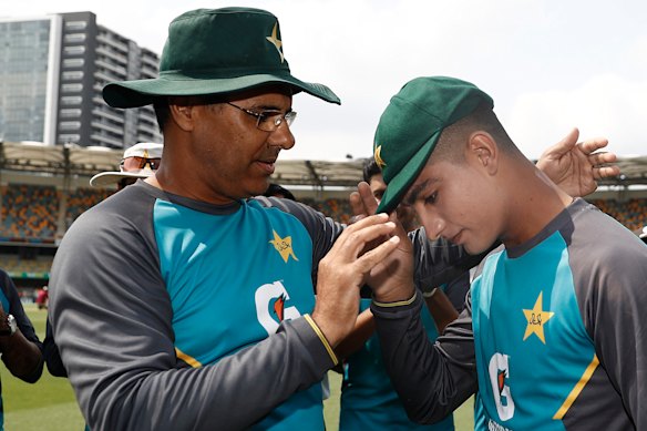 Pakistan great Waqar Younis presents 16-year-old Naseem Shah with his first Test cap.