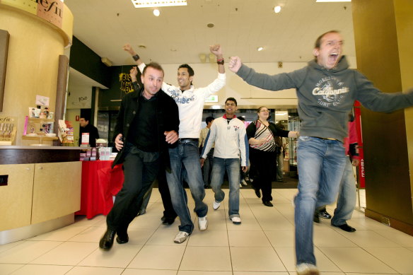 Shoppers rushing into a Myer store for Boxing Day sales in 2016.