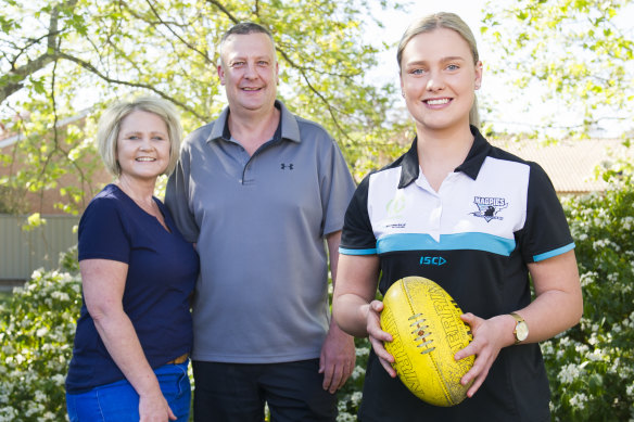 Canberra-based AFLW draft prospect Maggie Gorham, with her parents Brett Gorham and Donna Gorham at their Canberra home.