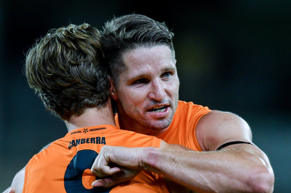 Callan Ward and Jesse Hogan celebrate the Giants’ win over Port Adelaide.