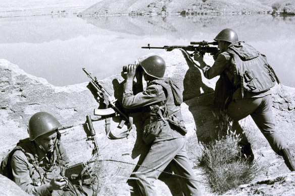 Moscow’s botched invasion of Afghanistan in the 1980s sowed seeds of discord. Soviet soldiers observe the highlands, while fighting guerrillas at an undisclosed location in Afghanistan.