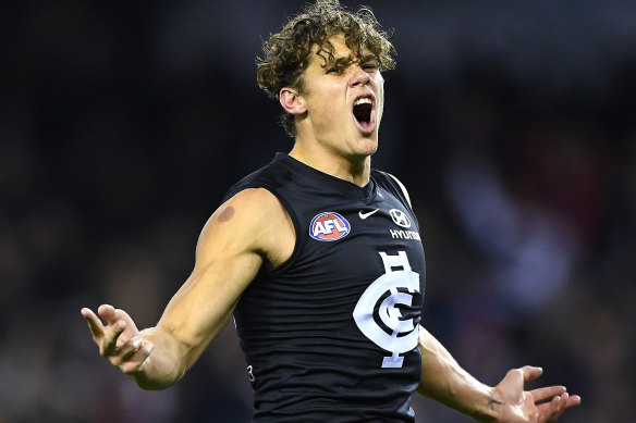 Charlie Curnow celebrates a goal in June 2019, against the Western Bulldogs, just before he was injured.