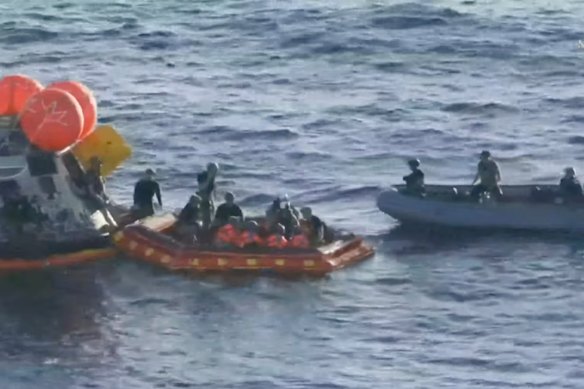 All four crew members (in orange) are now out of the Integrity after splashdown.