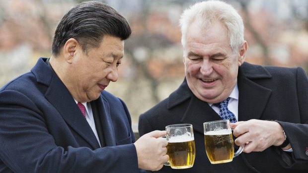 Czech Republic's President Milos Zeman, right, clinks glasses with Chinese President Xi Jinping.
