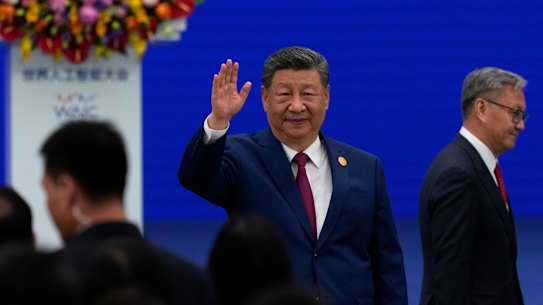 Chinese President Xi Jinping waves as he arrives at the opening ceremony for the World AI Conference.