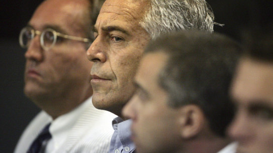 Jeffrey Epstein, centre, in court in 2008.