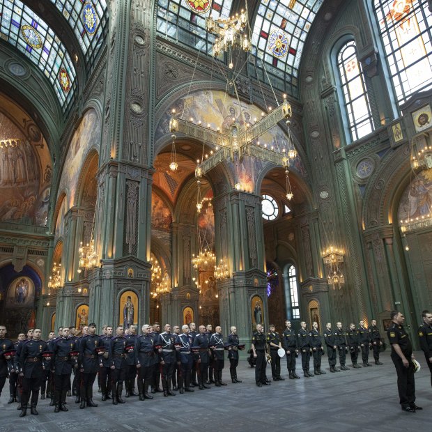 Russian servicemen attend a service at the cathedral. 