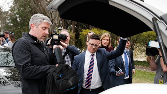 AFP officers arrived at the home at 7am, and stayed for more than six hours, leaving with large plastic bags of evidence and several hard cases.