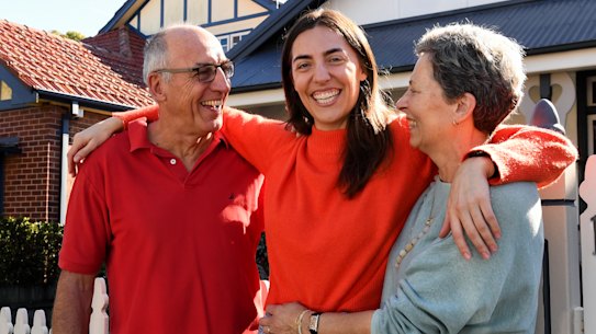 Hannah Rayment, 33, (centre) and her Baby Boomer parents John and Marea.