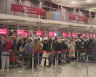 ‘Organised chaos’ at Melbourne Airport as long weekend begins