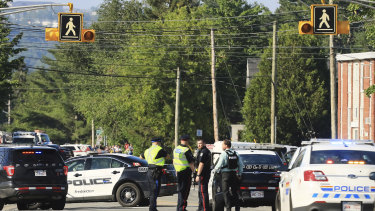Fredericton police say two officers were among four people who died.