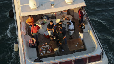 Tourists party on a yacht in Dubai last week. Since becoming one of the world's first destinations to open up for tourism, Dubai has promoted itself as the ideal pandemic vacation spot.