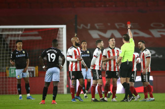 Sheffield United’s Phil Jagielka is shown a red card at Bramall Lane.  The Blades held on to beat Aston Villa 1-0.