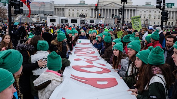Pro-life demonstrators hold a banner during the March for Life 2020 rally in Washington as Trump became the first US President to attend the event.
