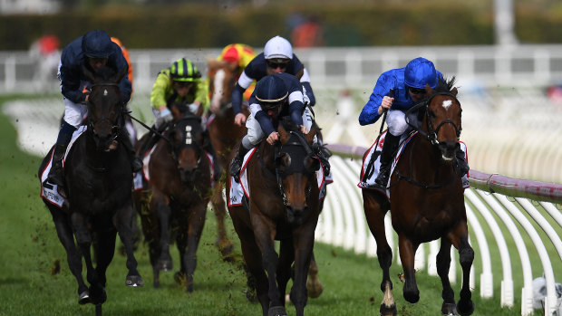 Best Solution (right) holds off Homesman (centre) to claim the Caulfield Cup.