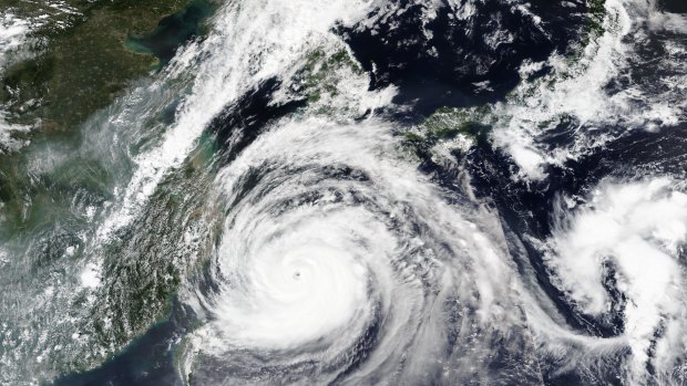 A satellite image released by NASA shows typhoon Maysak over Japan's southernmost islands on Tuesday.