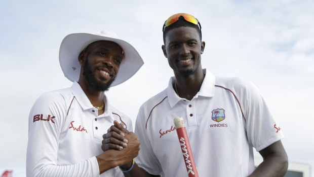 Upset: West Indies captain Jason Holder (right) and bowler Roston Chase after the first Test triumph.