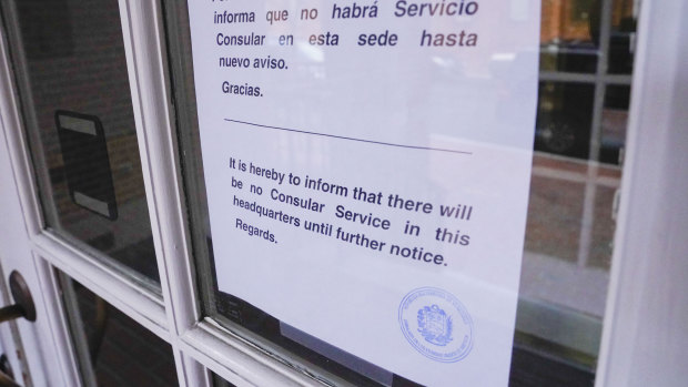 A sign is posted in both English and Spanish at the entrance to Venezuela's embassy in Washington on Thursday.