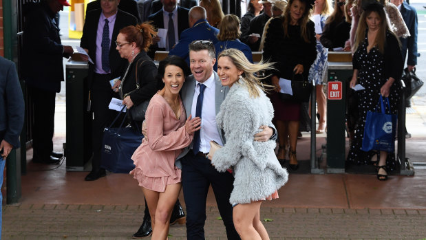 Racegoers arrive at the Caulfield Cup