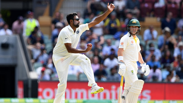 Off-break:  Indian all-rounder Ravichandran Ashwin bowls watched on by Australia's Marcus Harris.