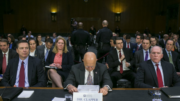 January 2017: James Comey, 
 then director of the FBI (left), James Clapper, then director of national intelligence (centre) and then CIA director John Brennan prepare to testify during a Senate hearing on Russian intelligence activities. 