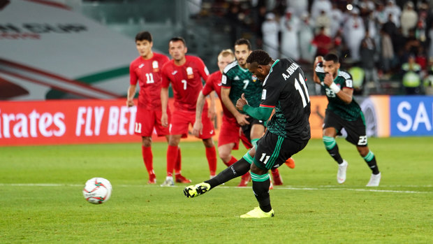 Hometown call: Ahmed Khalil scores a dubious late penalty for the UAE against Kyrgyzstan.
