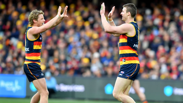 Crow show: Rory Sloane and Josh Jenkins in celebratory mood despite other results going against Adelaide in their bid to for a top-eight finish.