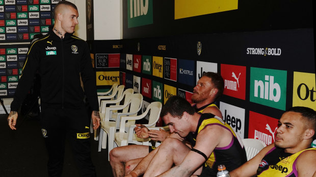 Support role: Dustin Martin (left) congratulates his Tiger teammates after their round 21 win over the Blues.