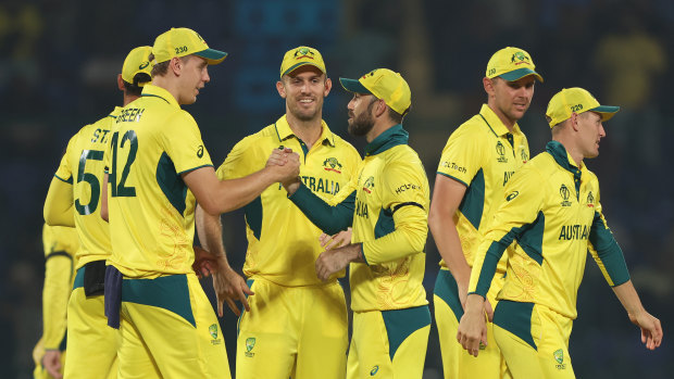 Australian players celebrate following their victory over the Netherlands.