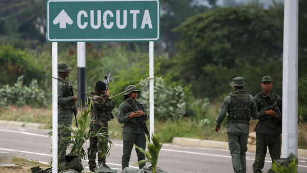 Venezuelan soldiers gather on the Venezuelan border near the Colombian city of Cucuta.