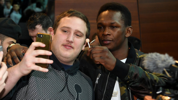 What pressure? Adesanya jokes around with a fan in Melbourne.