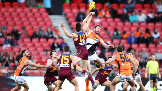 Ruck and ready: Stefan Martin of the Lions contests a bounce against Giant Dawson Simpson.