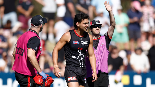 Mitch Owens in the hands of the Saints trainers on Saturday.