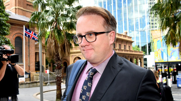Daily Telegraph journalist Jonathon Moran on his way to court on Monday.