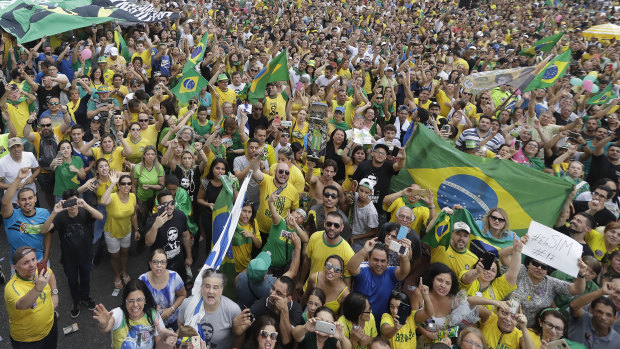 Supporters of Brazilian presidential candidate Jair Bolsonaro, rally along Paulista Avenue in Sao Paulo on Sunday.