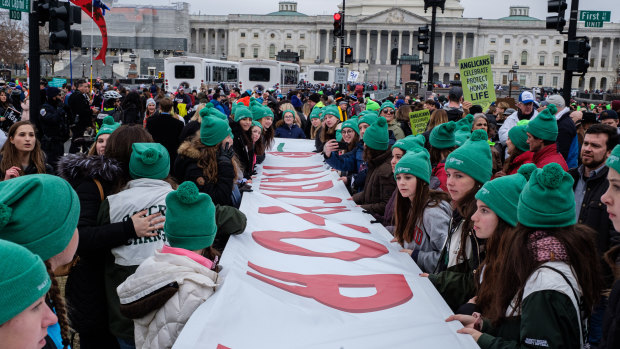Pro-life demonstrators hold a banner during the March for Life 2020 rally in Washington as Trump became the first US President to attend the event.